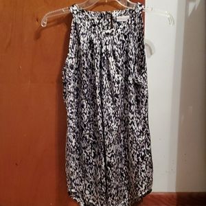 Sleeveless black and white shirt